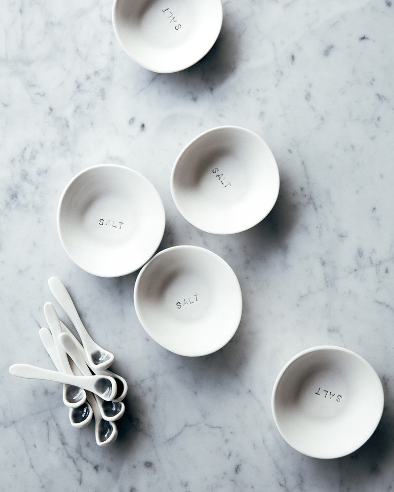 These small hand-made porcelain salt sets will add joy to your cooking routine. We keep them near the stove to add a pinch of salt as we cook.  Smooth stony unglazed finish. / Ces petits ensembles de porcelaine pour sel faits à la main apporteront de la joie à votre cuisine. Nous les gardons près du poêle pour avoir une pincée de sel à portée de main. Avec un fini pierreux et lisse.