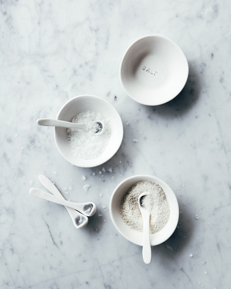 These small hand-made porcelain salt sets will add joy to your cooking routine. We keep them near the stove to add a pinch of salt as we cook.  Smooth stony unglazed finish. / Ces petits ensembles de porcelaine pour sel faits à la main apporteront de la joie à votre cuisine. Nous les gardons près du poêle pour avoir une pincée de sel à portée de main. Avec un fini pierreux et lisse.